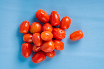 Group of Cherry Tomatoes isolated on blue background