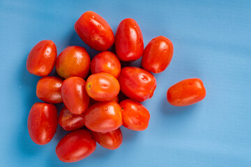Group of Cherry Tomatoes isolated on blue background