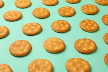 Flat lay with cracker biscuits on mint background
