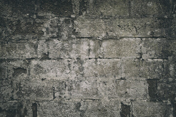 Old damaged brick wall. Rough solid texture and grunge surface backdrop.