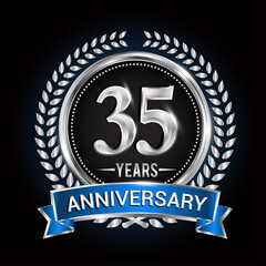 Birthday celebration logo 35th years with wreath, laurel, blue ribbon and silver ring.