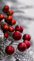 Christmas ball snow-covered fir tree, close-up, blurred bokeh background. Christmas background for a postcard. Decoration for a Christmas tree, spruce branches, New Year's toys.