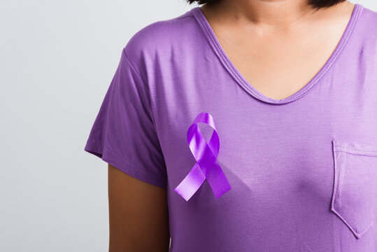 National Epilepsy or Alzheimer disease Day. Young woman stick purple ribbon on the chest symbol Pancreatic cancer, Epilepsy awareness and world Lupus Day and world cancer isolated white background