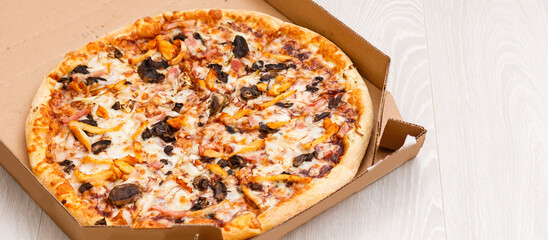 food order concept. Close-up top view of a ordering pizza with a laptop. all screen graphics are made up.