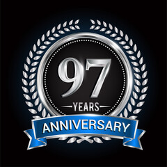 Birthday celebration logo 97th years with wreath, laurel, blue ribbon and silver ring.