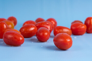 Group of Cherry Tomatoes isolated on blue background