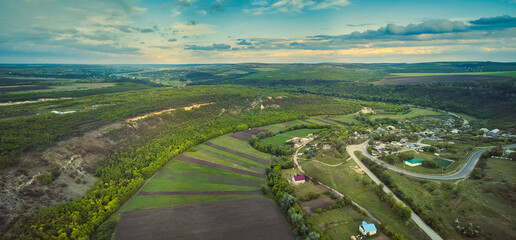 Little moldavian village Goeni in green lands, aerial view, summer time, Moldova republic of.