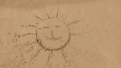 The symbol of the sun drawing on the sand