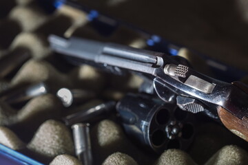 Obraz premium Firearms Revolver,Old revolver, .38 gun and ammunition,conceal gun with bullet home protection concept,handguns.