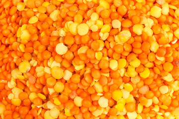 Background of the red and yellow lentils mix close-up