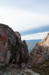 Baikal lake fresh water
flora shore reserve Russia Irkutsk park island Sky clouds clear Olkhon rocks trees embankments sand bay lagoon stones mountains hills horizon line panorama autumn water waves 