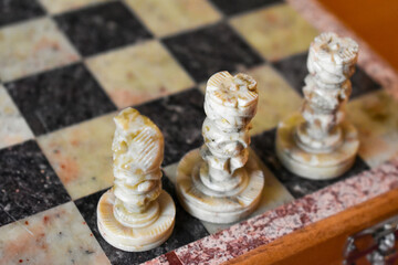 Jade chess pieces on a chessboard