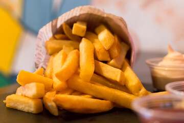 Deep French fries with several tasty sauces, deep fried Homemade Baked potato chips with several...