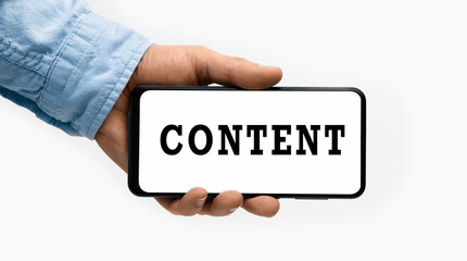 Closeup of a male hand holding Smartphone with word CONTENT on display