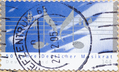 GERMANY - CIRCA 2004 : a postage stamp from Germany, showing some music notes with musical notes. 50 years of the German Music Council