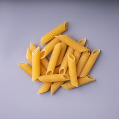 penne pasta isolated on gray background close up
