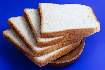 Close up of slices of toasts on blue background