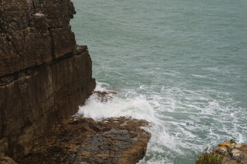 waves breaking on rocks