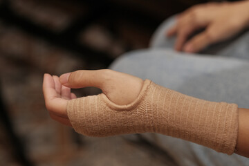 Women using a Tubular Bandage for provide tissue support in treating strains