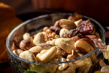 still-life of a bowl with mixed nuts and a blurred background 
