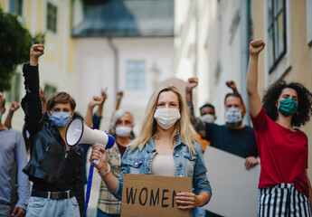 Group of people activists protesting on streets, women march and demonstration concept.