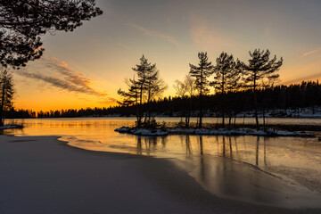 Beautiful winter sunset lake landscape