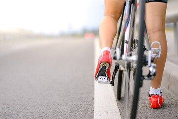 Woman Cyclist Preparing for Riding Bike on the Road. Adventure, Healthy Lifestyle, Sport