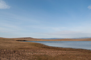 Baikal lake fresh water
flora shore reserve Russia Irkutsk park island Sky clouds clear Olkhon rocks trees embankments sand bay lagoon stones mountains hills horizon line panorama autumn water waves 