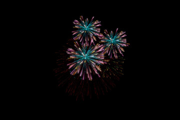Realistic 3D illustration colorful rainbow firework pyrotechnic night dark sky smoke on isolated black background wallpaper use celebrate happy new year countdown festival anniversary birthday party