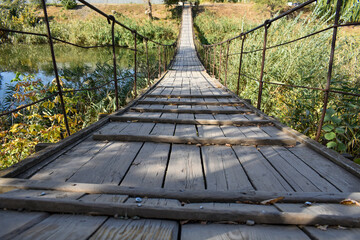 Old dangerous foot suspension bridge