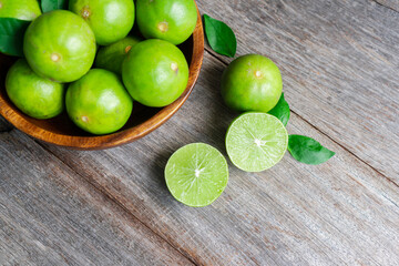 Close up of fresh citrus lemon lime on wooden background.