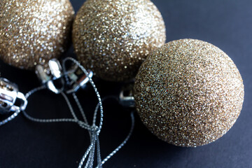 Christmas decoration yellow gold balls with black background. Christmas balls.