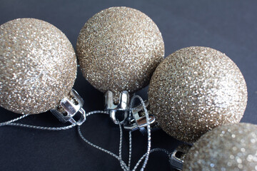 Christmas decoration yellow gold balls with black background. Christmas balls.