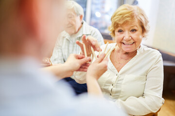 Demente senior citizen and doctor with colored pencils