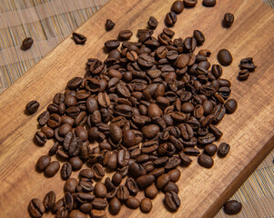roasted coffee beans and a cup of coffee