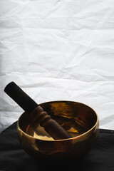 Tibetan singing bowl on a white background. Asian religious traditions. Spiritual and peaceful. 