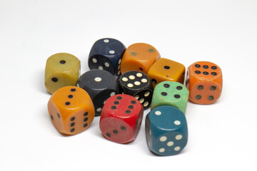 Old colorful dices on a white background