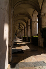 Fototapeta premium Building with arches between sun and shade
