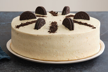Creamy cheesecake with chocolate cookies and cream biscuits. Copy space.
