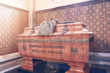 Tomb with remains of Emanuel Swedenborg in Uppsala Cathedral. The tomb of red granite. Massive...