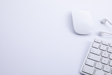new modern keyboard with computer mouse and earphones isolated on white background, close view ....