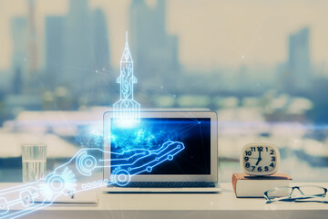 Desktop computer background in office and start up theme hologram drawing. Double exposure. Startup...