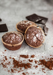 
Chocolate muffins with powdered sugar