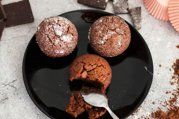 
Chocolate muffins with powdered sugar
