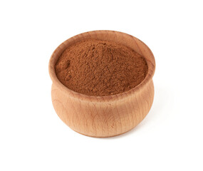ground cinnamon in a wooden bowl isolated on white background