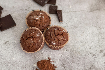 
Chocolate muffins with powdered sugar