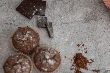 
Chocolate muffins with powdered sugar