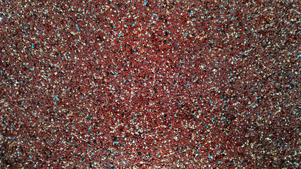 Empty multicolored corkboard or board with space for ad text. Close-up of corkboard texture shown.