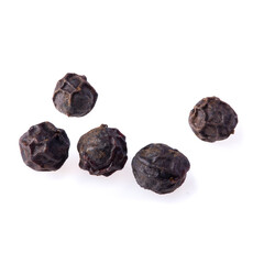 Close-up of black pepper isolated on a white background.