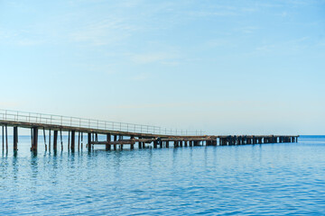 Fototapeta na wymiar Long pier on the sea with no people